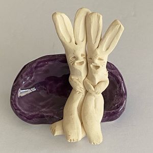 Unique Hand sculpted Ceramic Rabbits Cuddling on Purple Couch/Bench